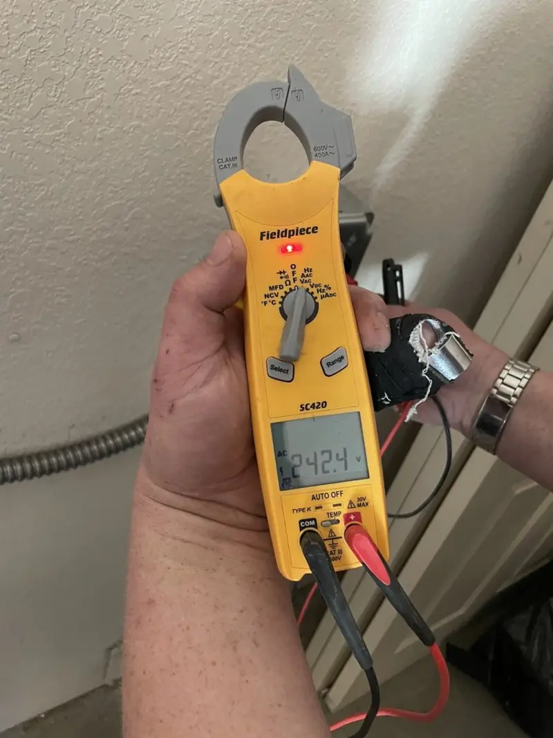 Voltage testing with clamp meter during Electrical Installation Services in Logan